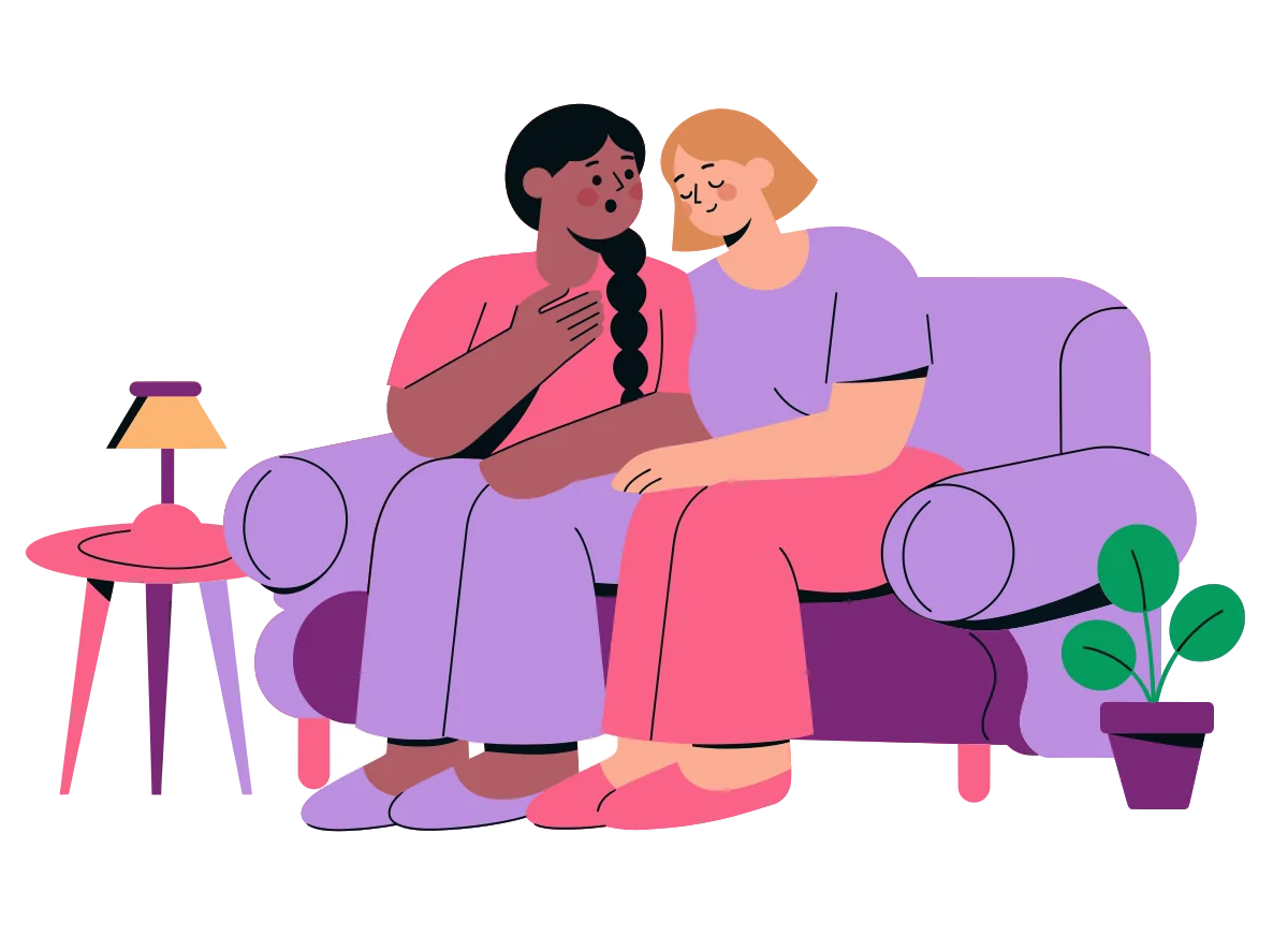 Two women on a sofa facing each other, one talking with a hand on her chest while the other leans in to listen