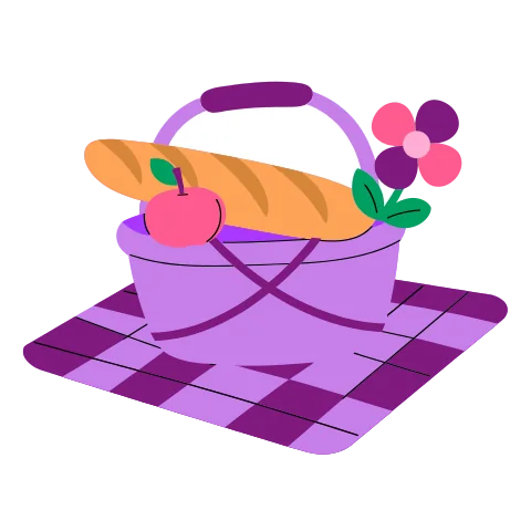 A picnic basket on a checked blanket with a baguette, an apple and a flower